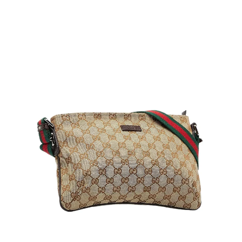 Women Gucci bags with a chain - link trim and a leather bodyGucci GG Canvas Web Crossbody (SHG-jpONI7)