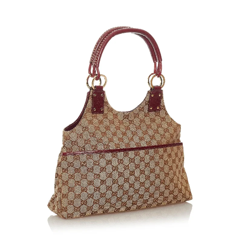 Women Gucci bags with interlocking G hardware for a classic lookGucci GG Canvas Handbag (27547)